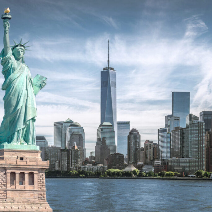 The,Statue,Of,Liberty,With,World,Trade,Center,Background,,Landmarks New York City